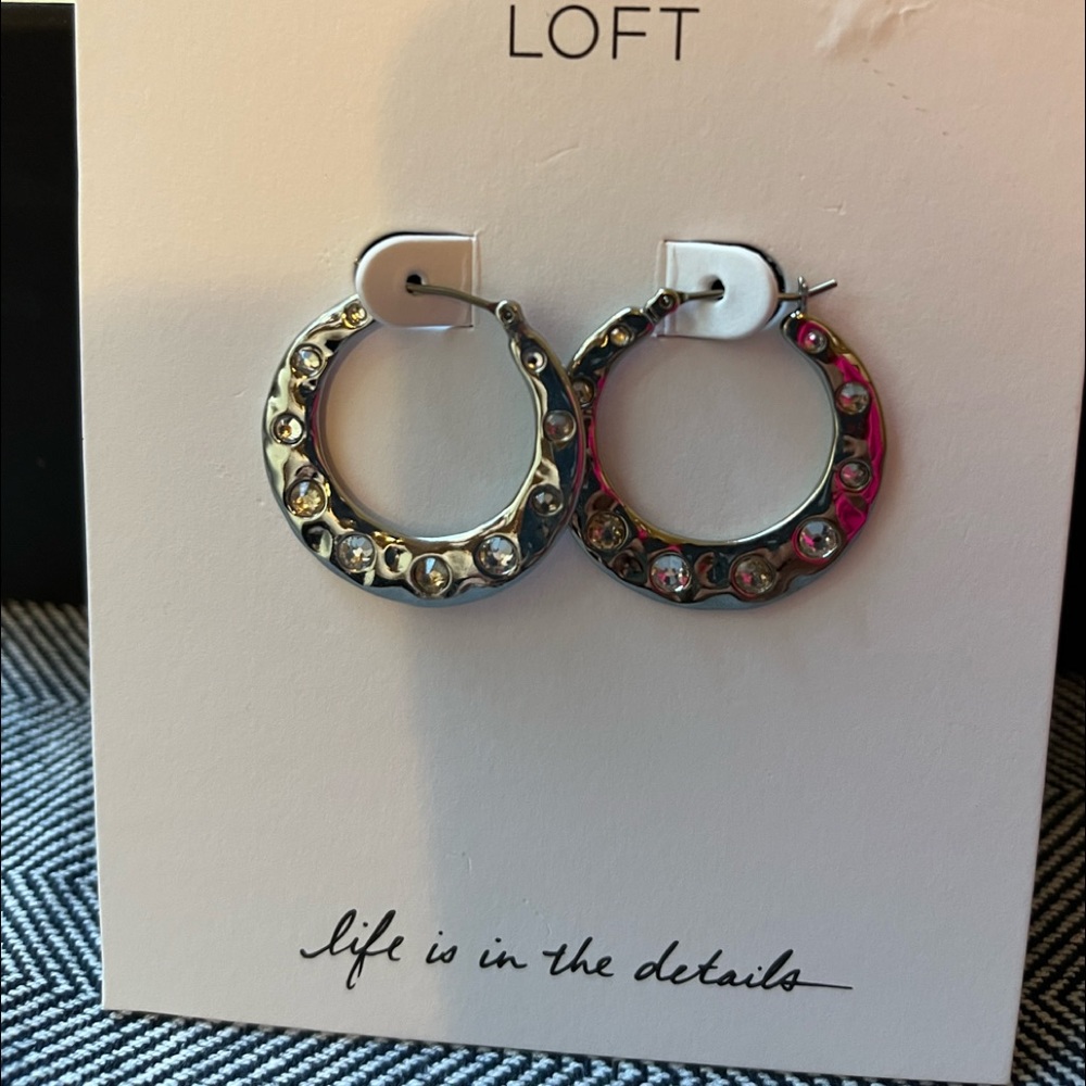 LOFT SILVER HOOPS with inserted clear stones.